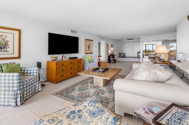 1900 Consulate Pl Unit 402, West Palm Beach, FL 33401 - living room featuring tile patterned flooring