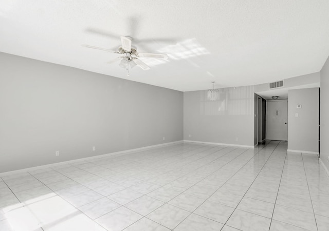 4821 NW 22nd Ct Unit 111, Lauderhill, FL 33313 - empty room featuring a ceiling fan, baseboards, light tile patterned floors, and a chandelier