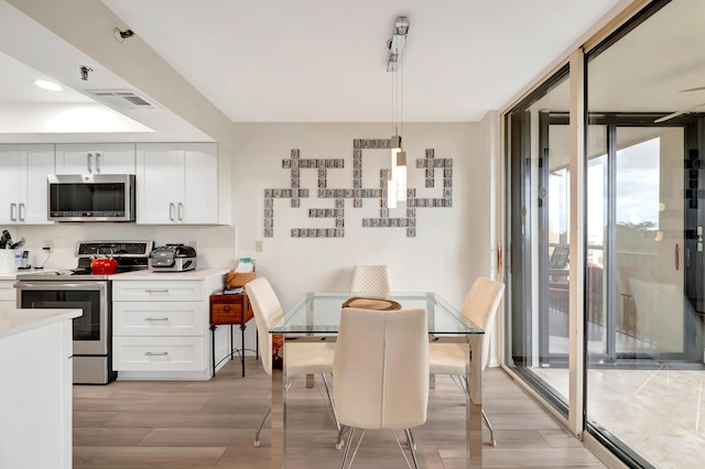 20100 Boca W Dr Unit 163, Boca Raton, FL 33434 - dining space with light wood finished floors and recessed lighting