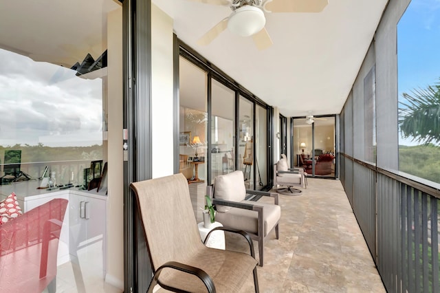 20100 Boca W Dr Unit 163, Boca Raton, FL 33434 - sunroom / solarium with ceiling fan and stone finish floors