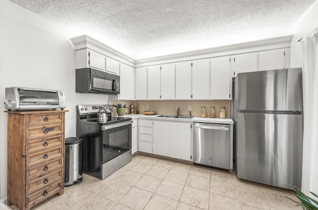 2513 25th Ln, Palm Beach Gardens, FL 33418 - kitchen with stainless steel appliances, a sink, light countertops, white cabinetry, and a textured ceiling