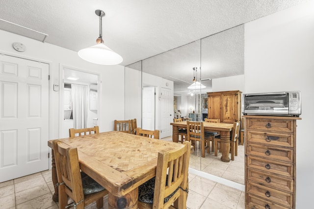 2513 25th Ln, Palm Beach Gardens, FL 33418 - dining room with a textured ceiling