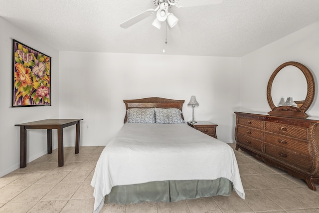 2513 25th Ln, Palm Beach Gardens, FL 33418 - bedroom with light tile patterned flooring, a ceiling fan, and a textured ceiling