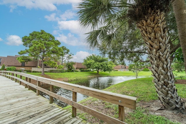 2513 25th Ln, Palm Beach Gardens, FL 33418 - dock area featuring a water view and a lawn