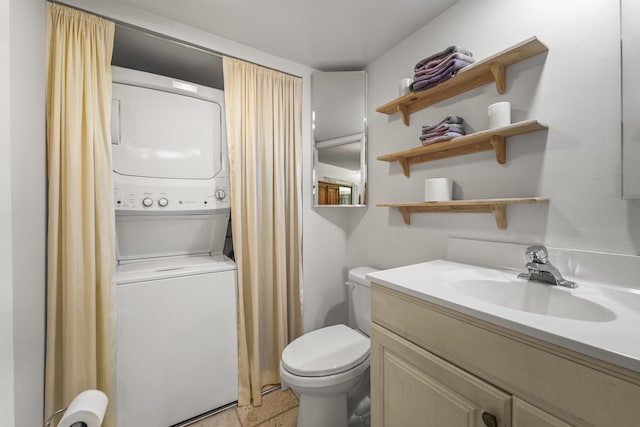2513 25th Ln, Palm Beach Gardens, FL 33418 - bathroom with stacked washer / dryer, vanity, and toilet