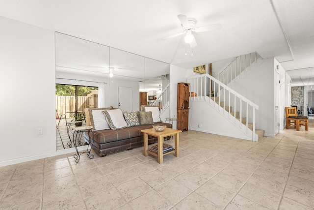 2513 25th Ln, Palm Beach Gardens, FL 33418 - living area with stairs, a ceiling fan, and baseboards