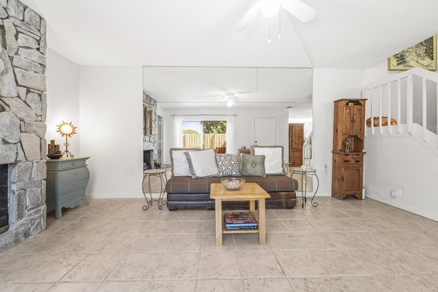 2513 25th Ln, Palm Beach Gardens, FL 33418 - living room with a ceiling fan, a fireplace, and stairs