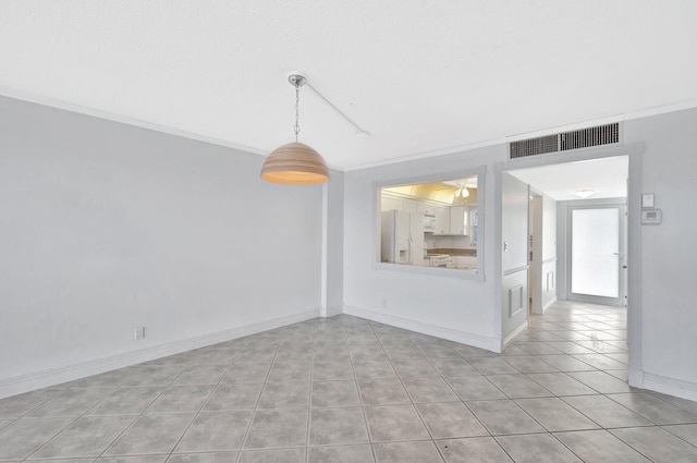 328 N Ocean Blvd Unit 404, Pompano Beach, FL 33062 - tiled spare room featuring crown molding and baseboards