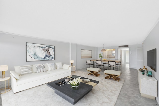 328 N Ocean Blvd Unit 404, Pompano Beach, FL 33062 - living room featuring crown molding, tile patterned flooring, and baseboards