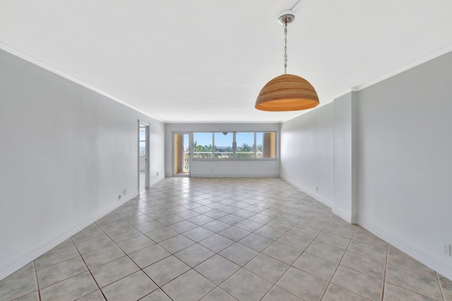 328 N Ocean Blvd Unit 404, Pompano Beach, FL 33062 - empty room featuring ornamental molding, light tile patterned floors, and baseboards
