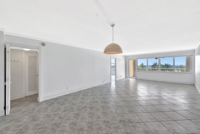 328 N Ocean Blvd Unit 404, Pompano Beach, FL 33062 - tiled empty room featuring ornamental molding and baseboards