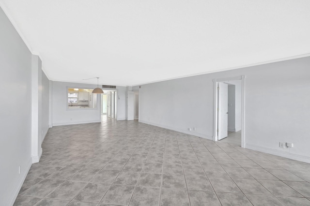 328 N Ocean Blvd Unit 404, Pompano Beach, FL 33062 - unfurnished room with ornamental molding, light tile patterned flooring, and baseboards