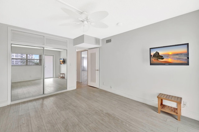 328 N Ocean Blvd Unit 404, Pompano Beach, FL 33062 - unfurnished bedroom with wood finished floors, baseboards, and ceiling fan