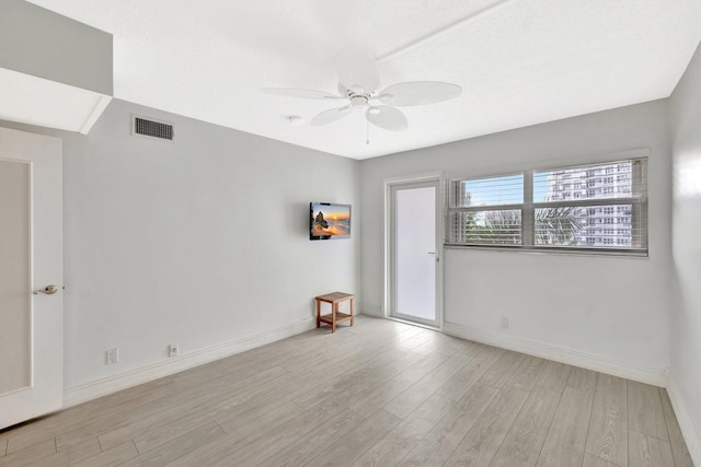 328 N Ocean Blvd Unit 404, Pompano Beach, FL 33062 - unfurnished room featuring a ceiling fan, light wood-style flooring, and baseboards