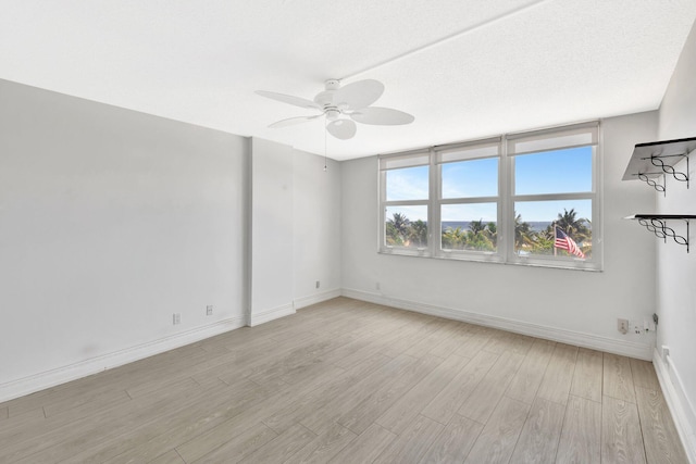 328 N Ocean Blvd Unit 404, Pompano Beach, FL 33062 - unfurnished room featuring ceiling fan, light wood-style flooring, and baseboards