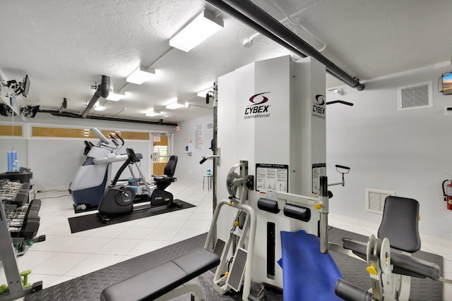328 N Ocean Blvd Unit 404, Pompano Beach, FL 33062 - exercise room with tile patterned floors