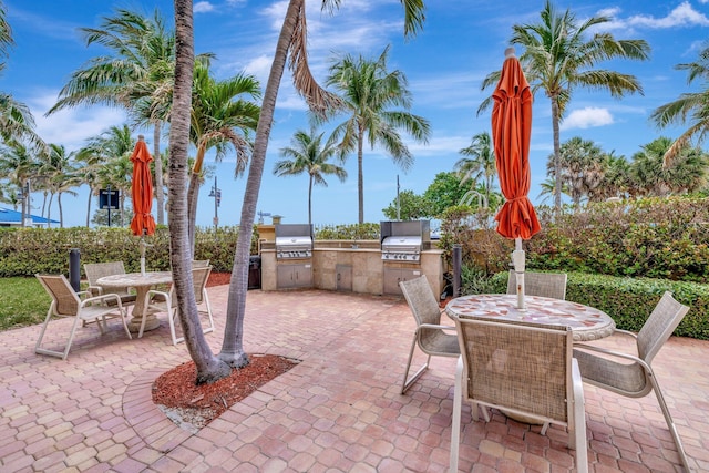 328 N Ocean Blvd Unit 404, Pompano Beach, FL 33062 - view of patio with outdoor dining area