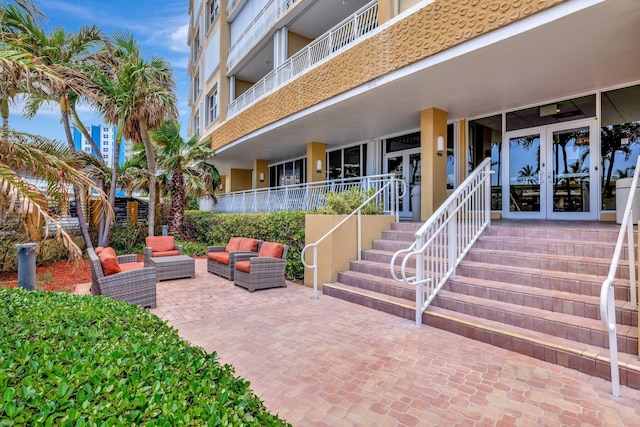 328 N Ocean Blvd Unit 404, Pompano Beach, FL 33062 - view of patio featuring french doors and an outdoor living space