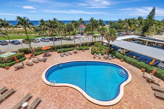 328 N Ocean Blvd Unit 404, Pompano Beach, FL 33062 - community pool featuring a patio and a water view