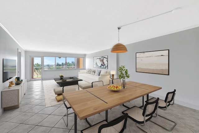 328 N Ocean Blvd Unit 404, Pompano Beach, FL 33062 - dining room featuring light tile patterned floors, ornamental molding, and baseboards