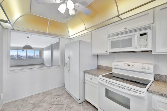 328 N Ocean Blvd Unit 404, Pompano Beach, FL 33062 - kitchen featuring white appliances, light tile patterned floors, white cabinetry, and a ceiling fan