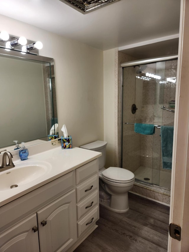 302 Wellington Unit B, West Palm Beach, FL 33417 - full bath with toilet, vanity, a shower stall, and wood finished floors