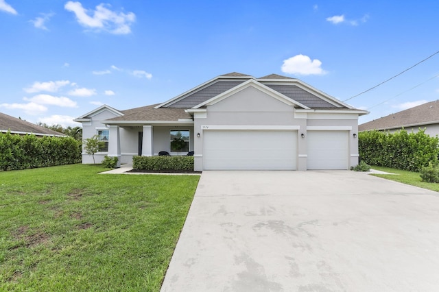 3974 SW Jarmer Rd, Port Saint Lucie, FL 34953 - view of front of property with an attached garage, driveway, a front lawn, stucco siding, and a shingled roof