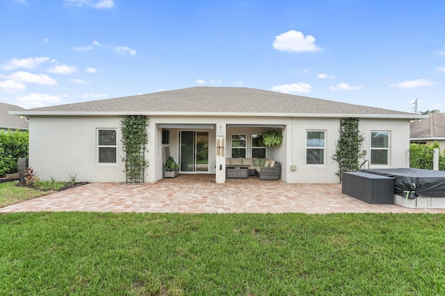 3974 SW Jarmer Rd, Port Saint Lucie, FL 34953 - back of property with a hot tub, an outdoor living space, a patio, stucco siding, and a yard