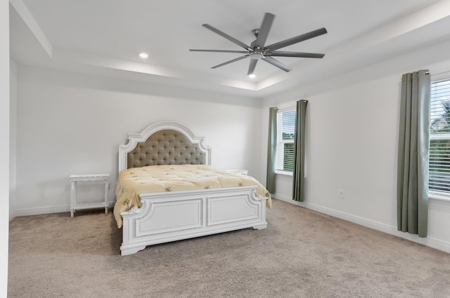 3974 SW Jarmer Rd, Port Saint Lucie, FL 34953 - bedroom with a raised ceiling, light carpet, recessed lighting, and baseboards