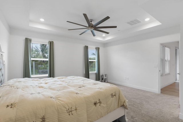 3974 SW Jarmer Rd, Port Saint Lucie, FL 34953 - bedroom with a tray ceiling, recessed lighting, light colored carpet, baseboards, and a ceiling fan