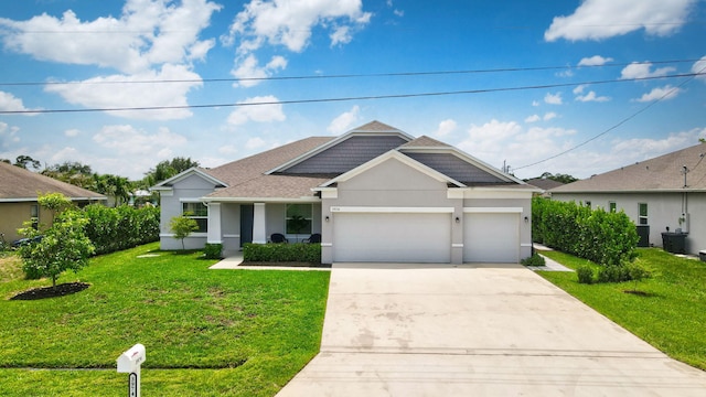 3974 SW Jarmer Rd, Port Saint Lucie, FL 34953 - view of front of property featuring concrete driveway, a front yard, an attached garage, stucco siding, and roof with shingles