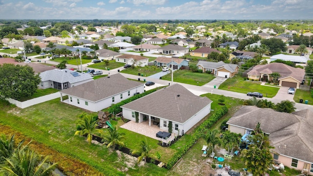 3974 SW Jarmer Rd, Port Saint Lucie, FL 34953 - aerial perspective of suburban area