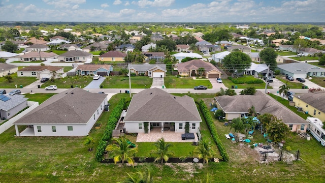 3974 SW Jarmer Rd, Port Saint Lucie, FL 34953 - aerial perspective of suburban area