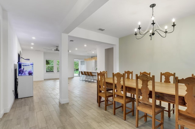 3974 SW Jarmer Rd, Port Saint Lucie, FL 34953 - dining area featuring a chandelier, light wood-style flooring, baseboards, recessed lighting, and ceiling fan