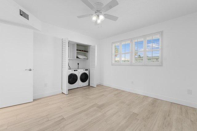 109 Wettaw Ln Unit 103, North Palm Beach, FL 33408 - washroom featuring independent washer and dryer, light wood-type flooring, ceiling fan, and baseboards