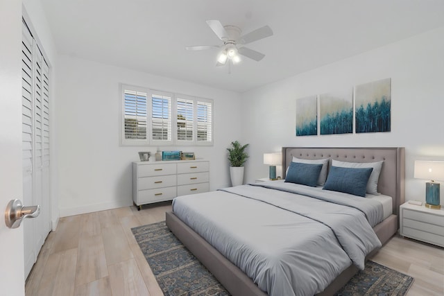 109 Wettaw Ln Unit 103, North Palm Beach, FL 33408 - bedroom featuring light wood-type flooring and a ceiling fan