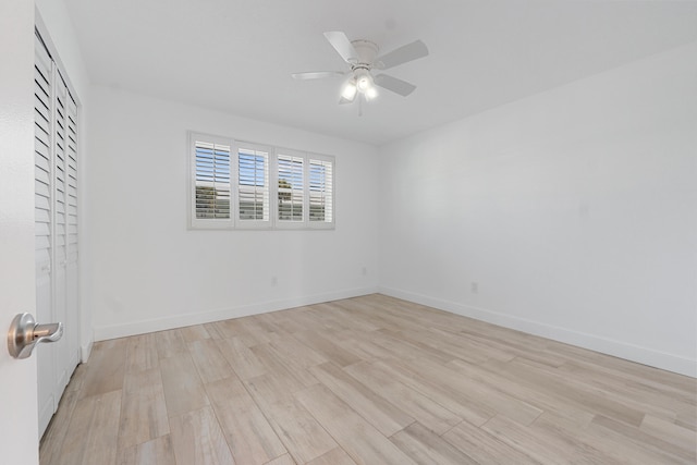 109 Wettaw Ln Unit 103, North Palm Beach, FL 33408 - unfurnished bedroom with light wood-type flooring, baseboards, and a ceiling fan