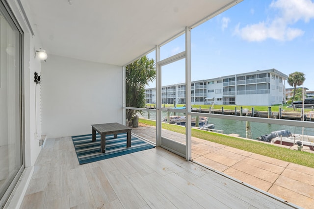 109 Wettaw Ln Unit 103, North Palm Beach, FL 33408 - unfurnished sunroom with a water view