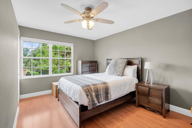 12373 Cascades Pointe Dr, Boca Raton, FL 33428 - bedroom with baseboards, light wood-type flooring, and ceiling fan