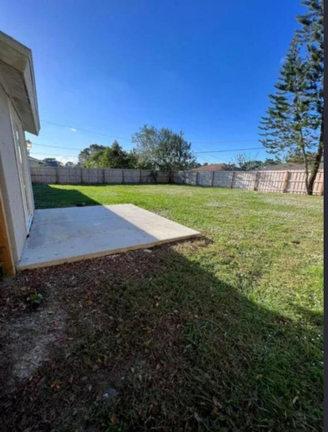 343 SE Husted Ter, Port Saint Lucie, FL 34983 - view of yard featuring a patio area
