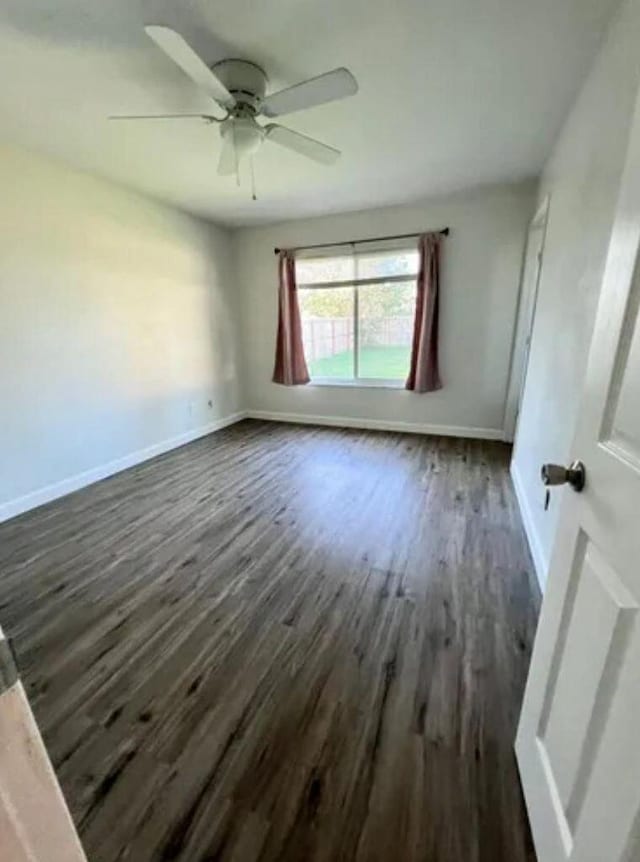 343 SE Husted Ter, Port Saint Lucie, FL 34983 - unfurnished room with dark wood finished floors, a ceiling fan, and baseboards