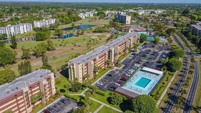 3524 Via Poinciana Unit 604, Greenacres, FL 33467 - bird's eye view of apartment complex / building, a large body of water, and a pool area