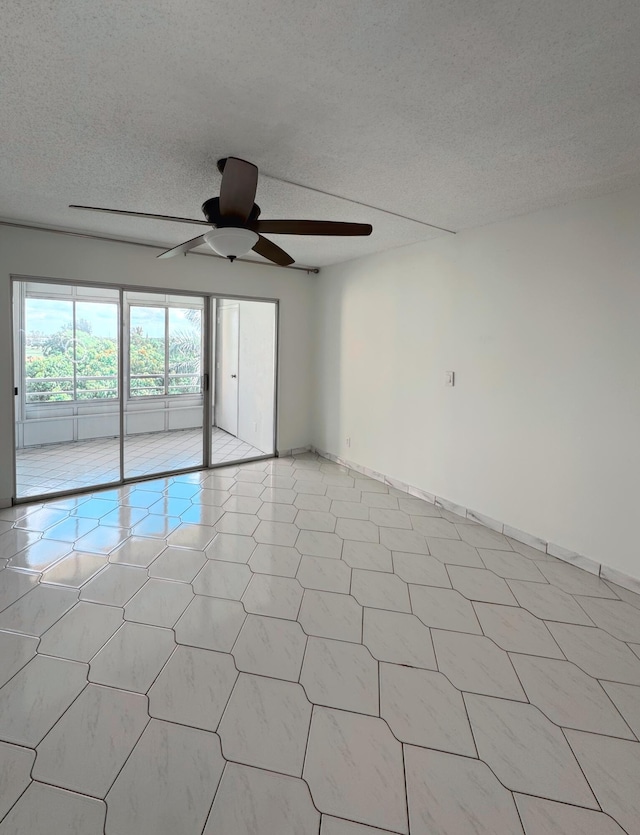 3524 Via Poinciana Unit 604, Greenacres, FL 33467 - spare room with ceiling fan, light flooring, and a textured ceiling