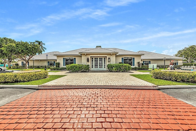 180 Cypress Club Dr Unit 813, Pompano Beach, FL 33060 - view of front of house featuring french doors