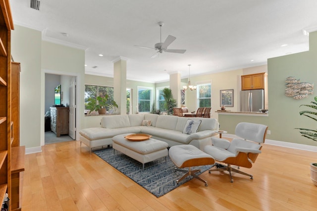 2683 SW Greenwich Way, Palm City, FL 34990 - living area featuring ornamental molding, light wood-type flooring, recessed lighting, a chandelier, and healthy amount of natural light