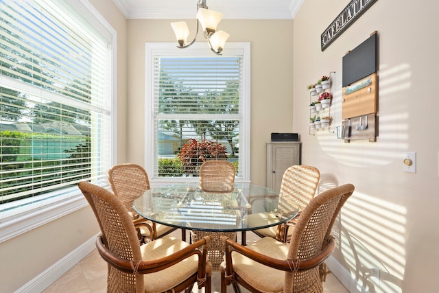 2683 SW Greenwich Way, Palm City, FL 34990 - dining space featuring a chandelier, baseboards, healthy amount of natural light, and ornamental molding