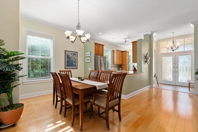 2683 SW Greenwich Way, Palm City, FL 34990 - dining space with a chandelier, ornamental molding, baseboards, healthy amount of natural light, and recessed lighting