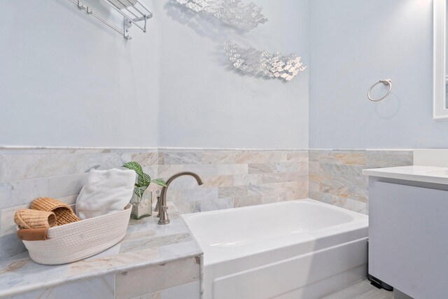 2683 SW Greenwich Way, Palm City, FL 34990 - bathroom featuring a garden tub and vanity