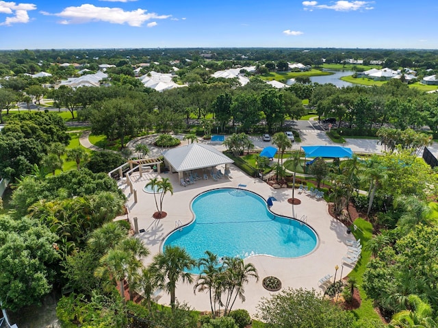 2683 SW Greenwich Way, Palm City, FL 34990 - aerial view of a pool, a tree filled landscape, and a nearby body of water