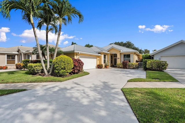 2683 SW Greenwich Way, Palm City, FL 34990 - single story home with an attached garage, stucco siding, and concrete driveway